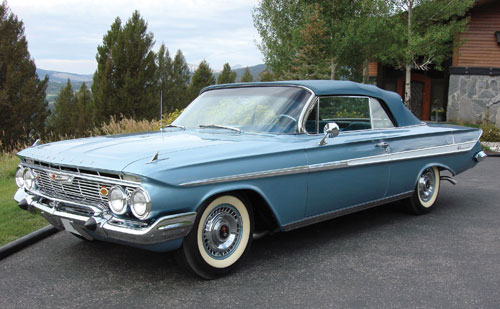 The 1961 Impala Convertible presented here finished in Jewel Blue with a 